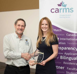 Dr. Roger Strasser, Dean of the Northern Ontario School of Medicine, presents the 2014 Sandra Banner Student Award for Leadership to Dr. Sarah Mary McIsaac during the CaRMS Forum at the Canadian Conference of Medical Education in Ottawa. 