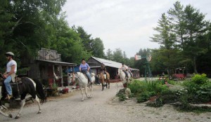 Riders head out on a trail ride from Kicking Mule Ranch, a cowboy-themed stable that also offers lessons for kids, pony and buggy rides, campfires, jamborees and bunkie accommodations in Tehkummah.