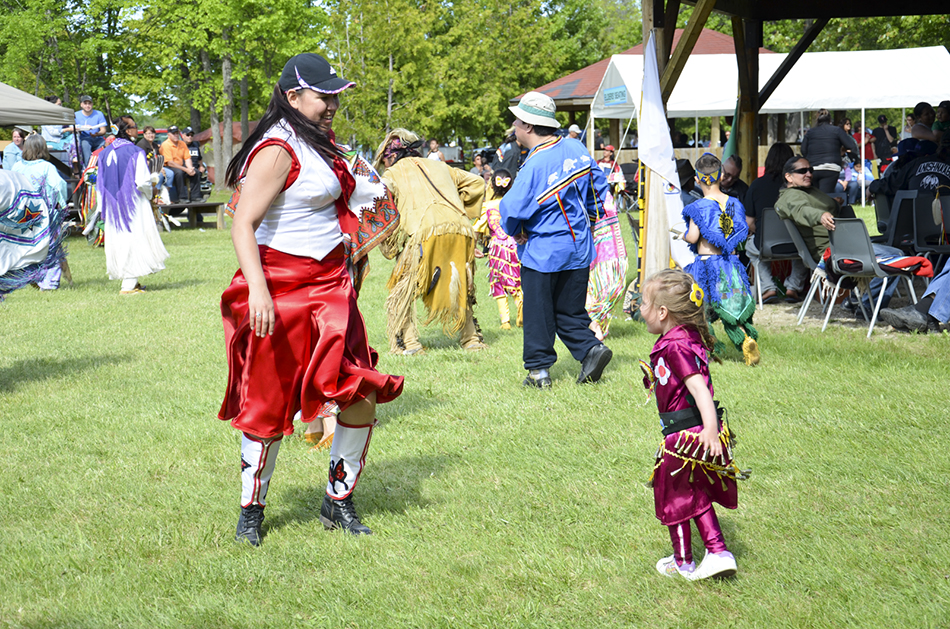 The powwow dance arena provides a wonderful place for families and dancers to bond. photos by Michael Erskine