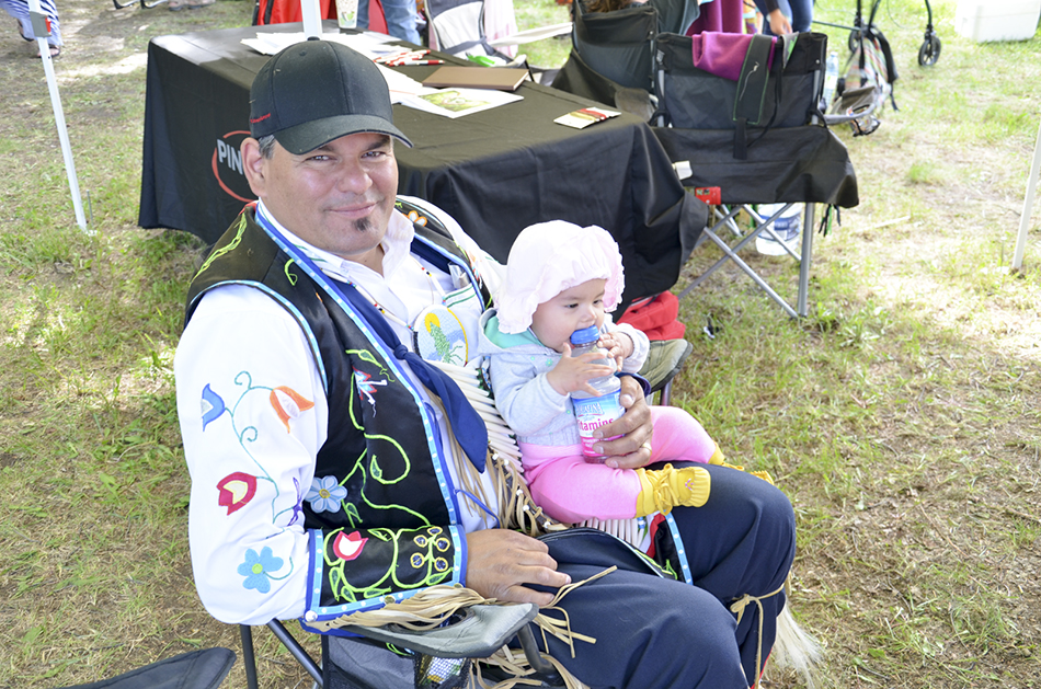 Serpent River Chief Isadore Day enjoys some quality family time.