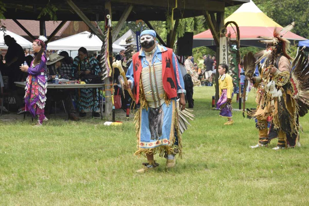 Dancers of all styles make their way around the Aundeck Omni Kaning powwow arena. This powwow has been proclaimed by organizers as the biggest in the powwow’s history. photo by Michael Erskine.