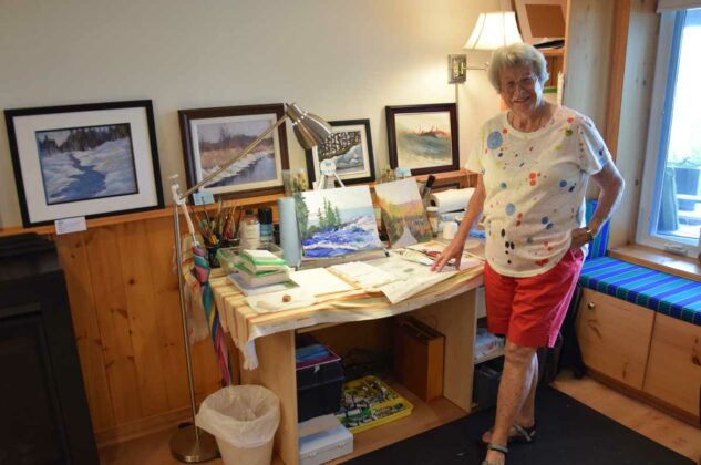 Artist Gail Meehan poses with some of her work at her Honora Bay studio.