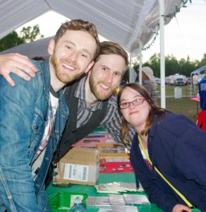 Kelsey Barss thought purchasing a CD from her favourite bluegrass band would be the highlight of her day, but she was over the moon to have a picture taken with  The Abrams (John and James) to top off her Bluegrass in the Country experience. photo Peggy Smith