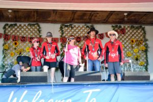 Janet Anning, MSO coordinator, joined by MSO athletes, speaks of the group’s many achievements this year. photo by Robin Burridge