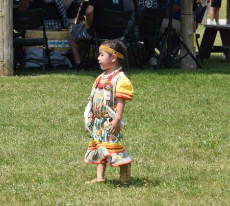 This Tiny Tot jingle dancer is about as cute as it gets. Youth are learning more about their history and culture these days and powwows help. photo by Michael Erskine