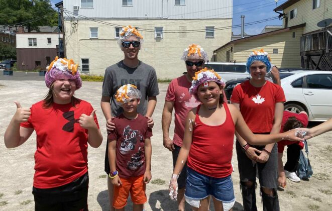 Cheesy Canada Day fun in Gore Bay. Some of the participants who played a shaving cream and Cheetos tossing game.