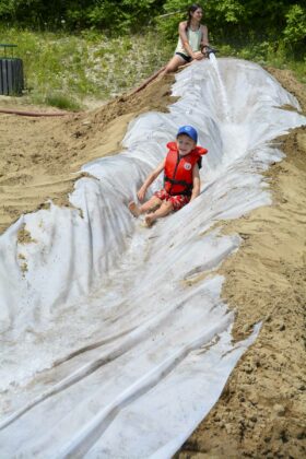 Tobias Van Velven enjoys the waterslide at the Manitowaning beach.