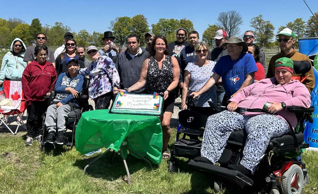 Residents and staff of Community Living Manitoulin pose for a photo during a wrapup barbecue event held May 26.