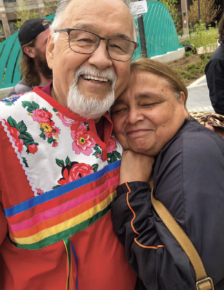 Reggie Leach and sister-in-law Cathie McGregor, niece of the late Dr. Lillian McGregor, exchange a hug following the unveiling of the new park.