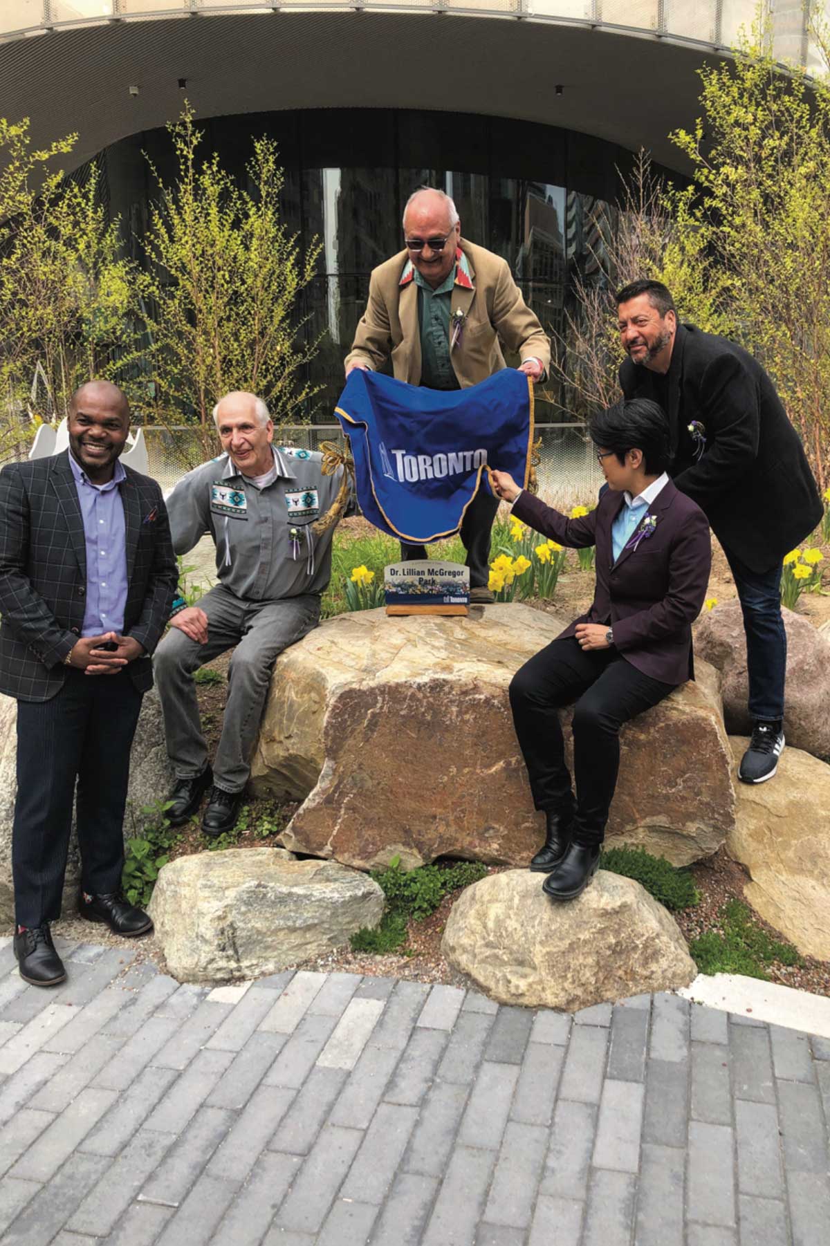 From left, Toronto City Councillor Chris Moise, Dave McGregor, Dennis McGregor, MPP Kristyn Wong-Tam and Ken McGregor pose for a photo during the unveiling of the Dr. Lillian McGregor Park in downtown Toronto. The idyllic new park was celebrated with Toronto politicians and a strong Birch Island contingent. photo by Peter Carter