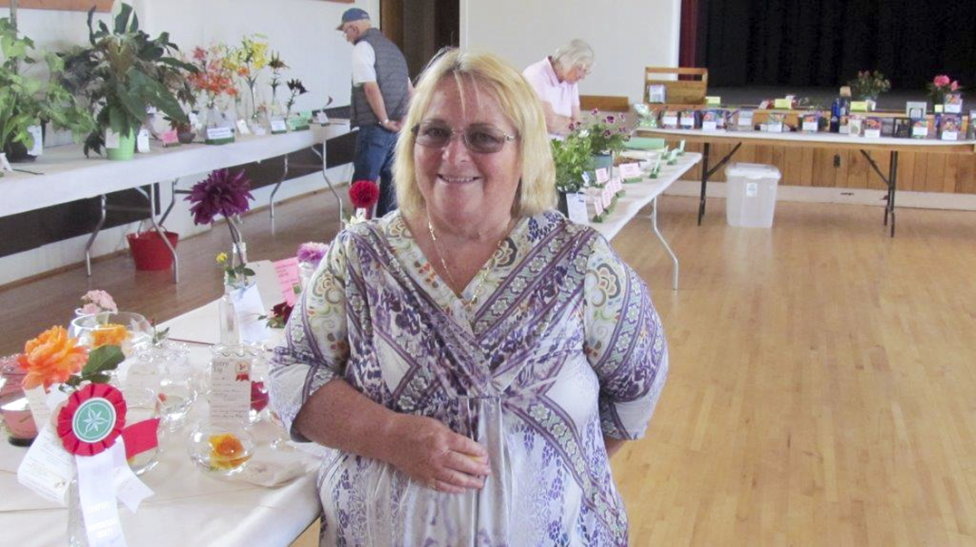 Sandra Strong is pictured with her award winning rose at the  Campbell Horticultural Society flower show.