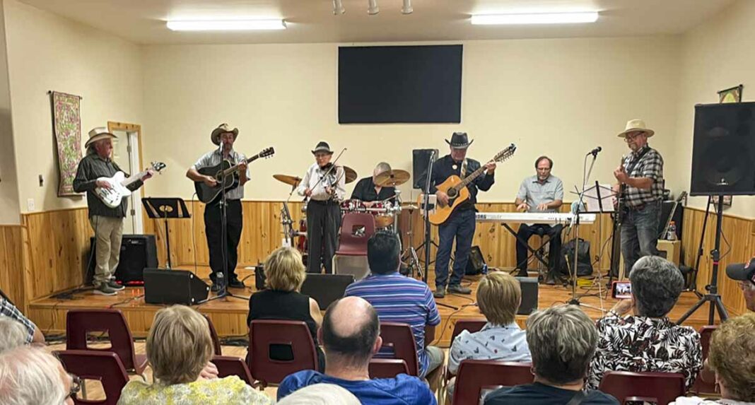 A group of well-known Island musicians gathered at the Sheguiandah Seniors’ Hall recently as the house band for George Williamson’s Great Northern Opry nomination celebration. Mr. Williamson is seen third from right in the black cowboy hat and playing the acoustic guitar. photo by Alicia McCutcheon