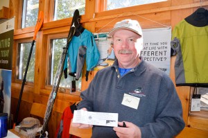 Brad Mackay of Wind and Wave selling Sea Cadet raffle tickets.