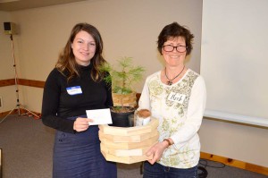 Organizer Barb Erskine  presents speaker Jenny Fortier with a more than token gift.