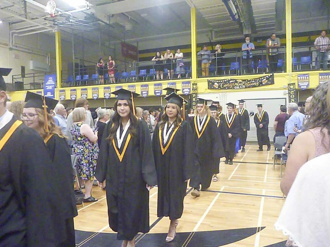 Students process into the hall ready for one of the landmark events of thier young lives—recieving their high school diplomas. photos by Alexandra Wilson-Zegil