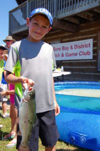 Avery Nodecker holds up his catch from the Gore Bay Fish and Game Club fish pond. 