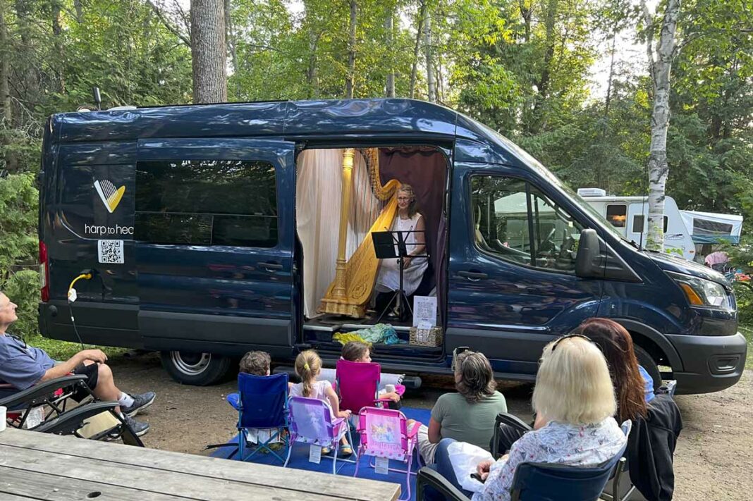 Renowned harp player Gianetta Baril pictured in her van at the Batman’s Resort on Manitoulin Island. photo by Joe Shorthouse