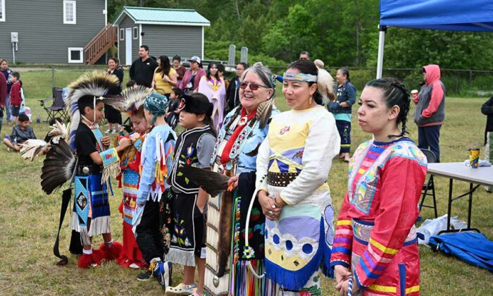 Dancers line up during the festivities at the Junior School Powwow in Wiikwemkoong. photo by Dwayne Animikwan