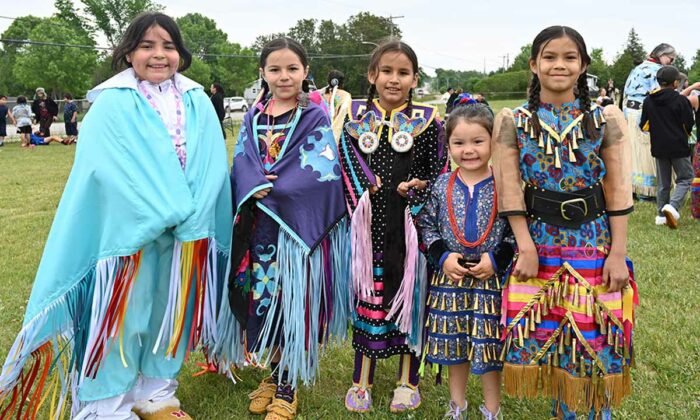 These dancers are all smiles as they pose for the camera at the Wiikwemkoong Junior School Powwow. photo by Dwayne Animikwan