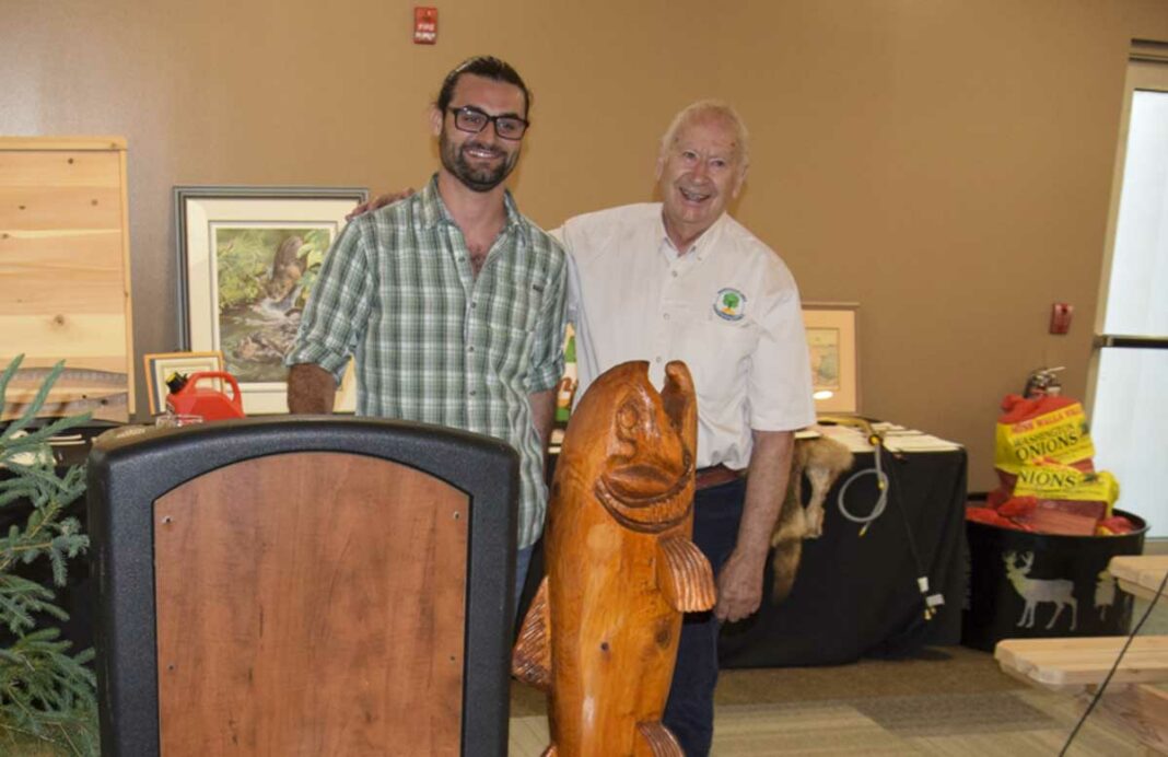 Ken Pearce was recognized as Manitoulin Streams Volunteer of the Year during the annual Jeans and Jackets Gala held at the Manitoulin Hotel and Conference Centre. Mr. Pearce took home an engraved custom-built coffee table as a memento of his award. He is pictured, left, with Master of Ceremonies Liam Campbell. photo by Michael Erskine