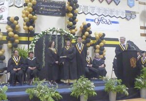 Jocelyn Kuntsi receiving her diploma.