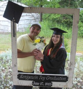 Early Childhood Education-Anishinaabemowin graduate Shelly Deforge poses for a photo following the 2023 Kenjgewin Teg graduation ceremony. photo by Veronica Roy