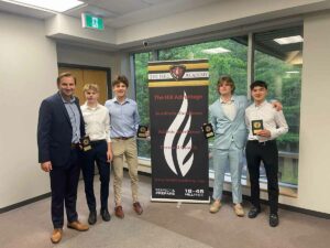 Kohyn Eshkawkogan, far right, poses with fellow award winners at The Hill Academy. Kohyn won the Defensive Player of the Year Award.