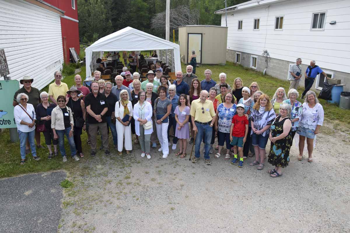 The artists of the 44th La Cloche Art Show gather for a group photo at the official launch of the show June 30.photo by Michael Erskine