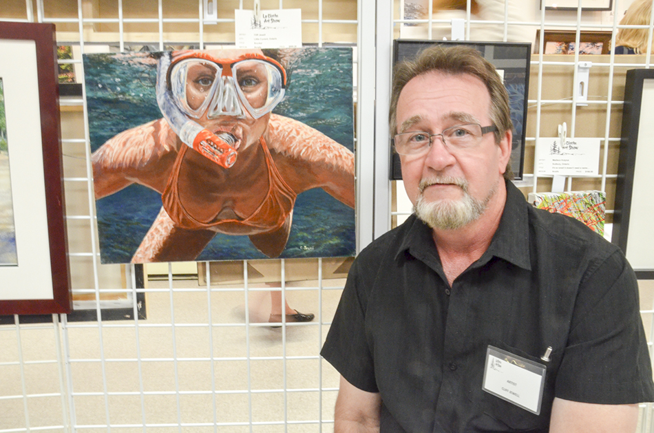 Little Current artist Cliff Jewell with one of his three entries in this year’s show.