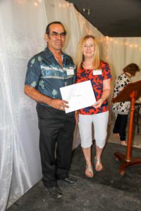 Gene Solomon receives the first prize sculpture awarded for his  ‘Jackleg Miner’ from La Cloche Art Show committee member Kerry Butler.