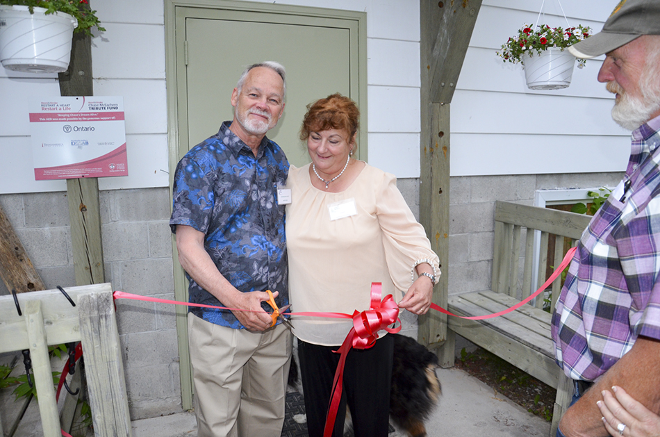 David Read,  La Cloche Art Show 2015 Distinguished Artist, and Carmella Ciccarelli, chair of this year’s art committee cut the ribbon opening the show.