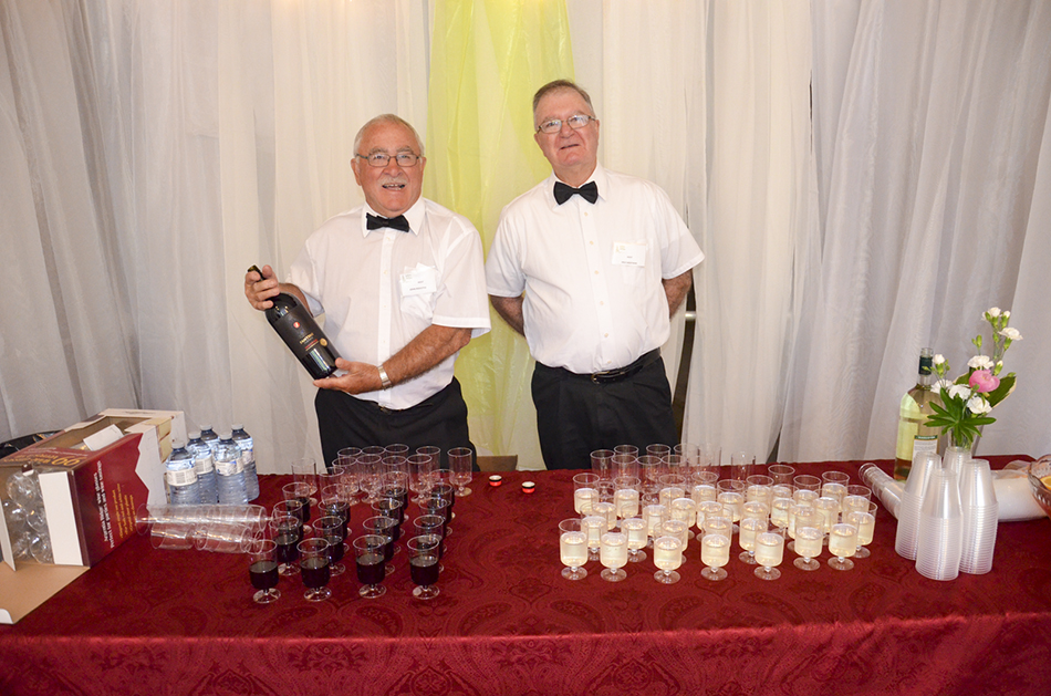 Wine stewards at the show opening served up  refreshments.