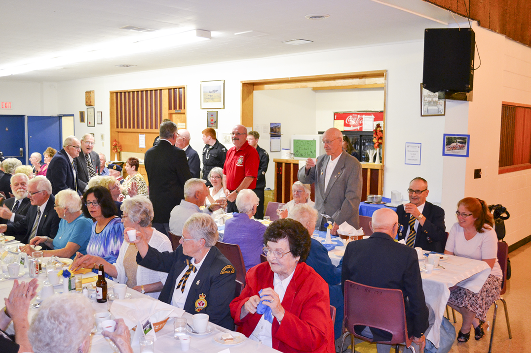 Veterans stand for a toast during the Royal Canadian Legion Branch #177 85th anniversary dinner and awards night. photos by Alicia McCutcheon