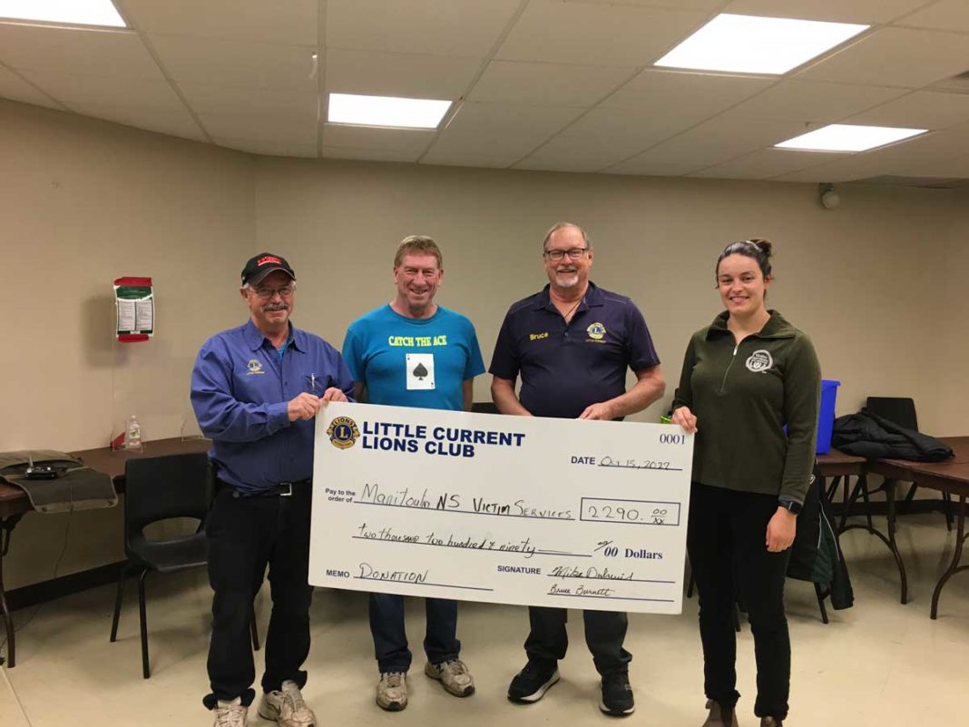 Catch the Ace committee members Lion Mike Dubreuil, Rick Thurston and Lion Bruce Burnett present a cheque to Jessica Summers.