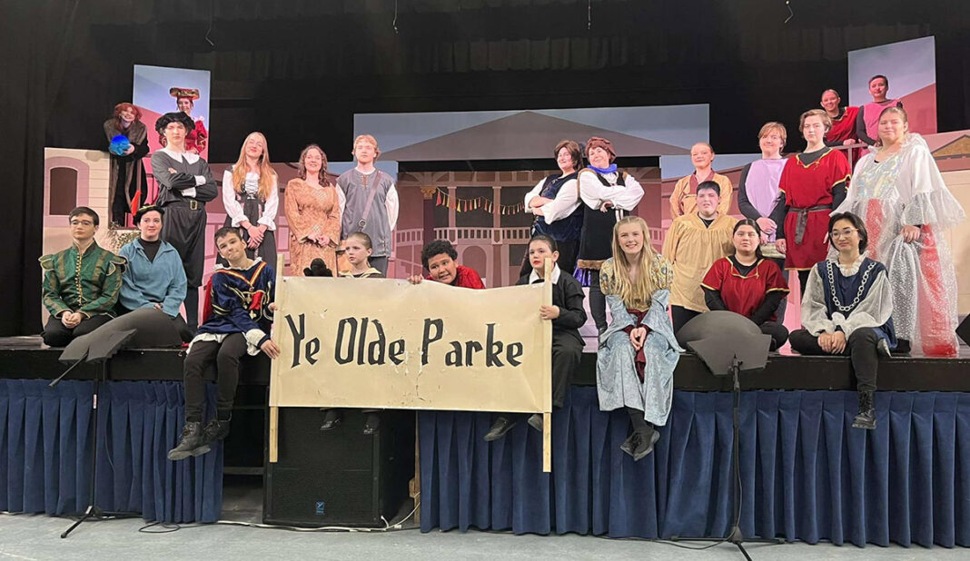 high school musical cast on the edge of stage