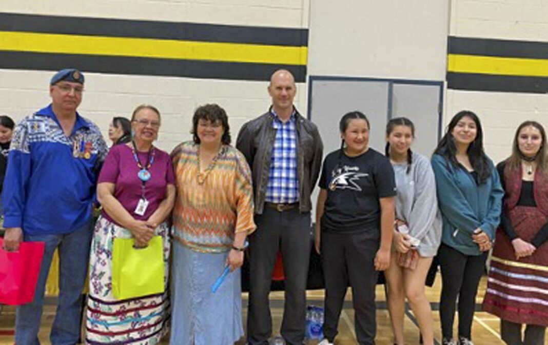 Rainbow District School Board Trustee Lisa Corbiere-Addison, third from left, is joined by MSS Acting-principal Dave Wichar to her right with community leaders, staff and student organizers.