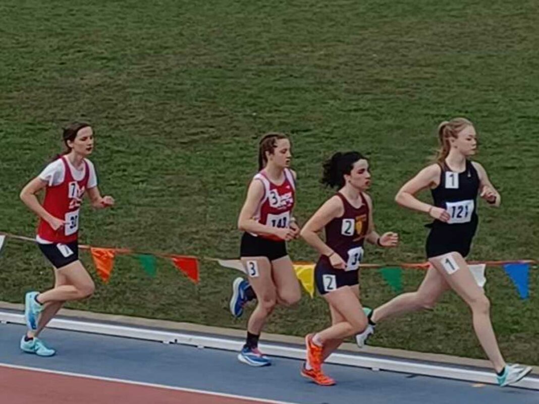 Manitoulin Secondary School Mustangs runner Maren Kasunich, far right in photo, finished in first place in her three events at the Nipissing Invitational track and field competition.