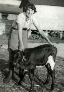 A young mary Buie on the farm in Devon circa August 1961. Ms. Buie never lost her love of the outdoors and working on the land.