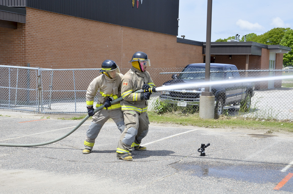 Fire teams competed in a number of skilled drills that focussed on essential firefighting tasks. photo by Michael Erskine