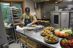 Simon DeSousa preparing the amazing meal in Mnaamodzawin's modern kitchen.