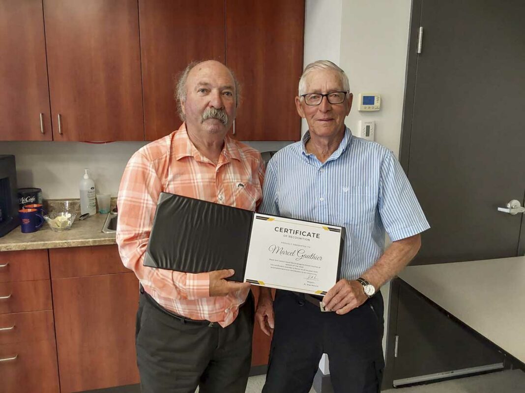 Northeast Town Mayor Al MacNevin, left, names Marcel Gauthier the municipality’s Senior of the Year.