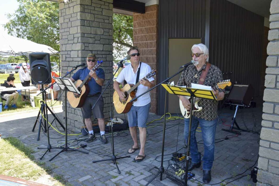 Musicians George Williamson (also a Northeast Town councillor), Tristen Hall and Barry Hamilton put on a great show to picnic-goers Sunday. photo by Michael Erskine