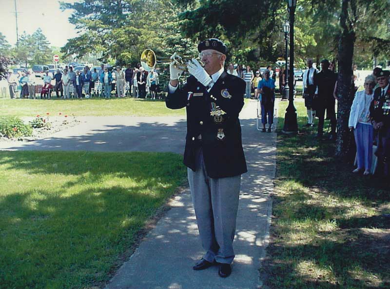 Ed Kift playing the bugle at one of countless Remembrance Day ceremonies in which he served.