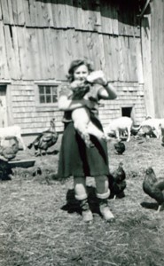 Rhea at 16 enjoying her pet lamb at home.