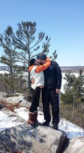 Nelson bends for a smooch from his beloved on one of their many hikes.