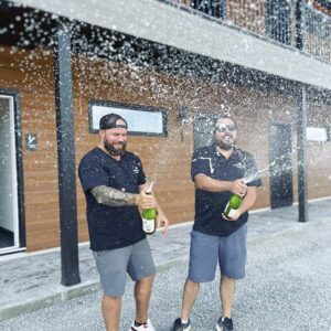 Braden Macaluso and Jordan Stephens celebrating the opening of Manitoulin Motel.