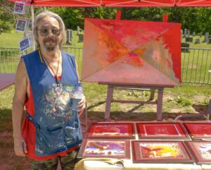 Muralist Michael Cywink was invited to create a large painting during the NorthWords Festival. photo by Isobel Harry