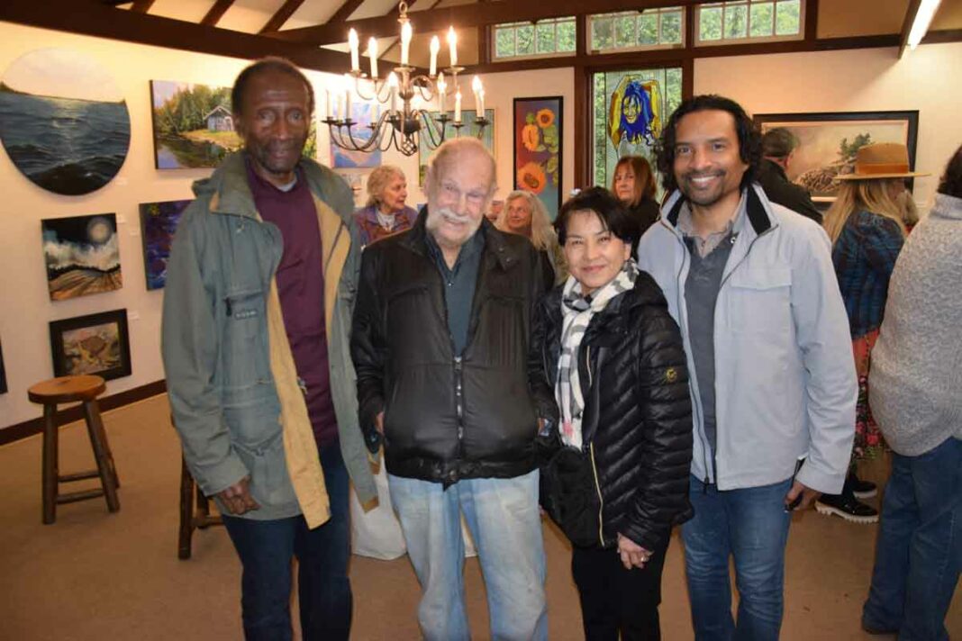 Dr. Richard Nanca-Bruce, his wife Joanna of Ghana and son Robert of Sudbury, stopped by the season opening of Perivale Gallery in Spring Bay to see their old friend Ivan Wheale as he unveiled his latest collection of work, ‘Dimensions: An Artist’s Vision,’ at the annual gallery opening. photo by Michael Erskine.