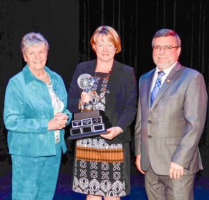 RDSB Chair Doreen Dewar and Director of Education Norm Blaseg present Central Manitoulin Public School Prinicpal Tracey Chapman with the Go Green Globe Award.