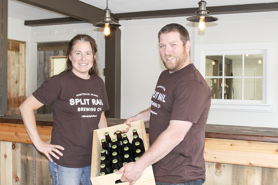 Andrea Smith sells the first case of Split Rail brew to Richard of Buoys Restaurant.